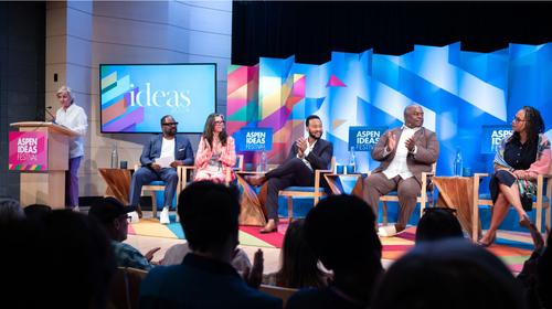 The team for Ear Hustle on a panel at the Aspen Ideas conference with John Legend